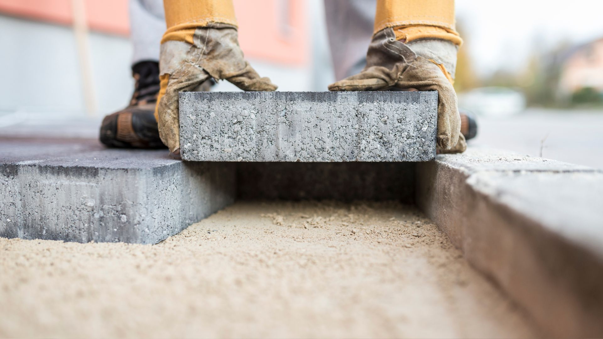 A person standing on top of a cement block
